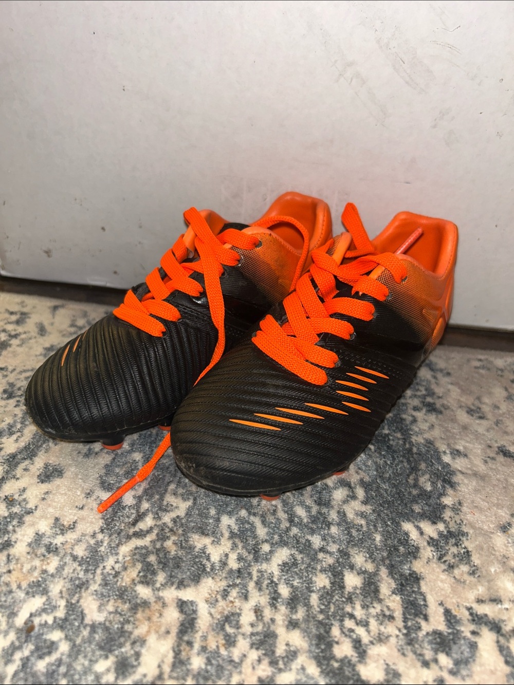 Toddler size 8 Black and Bright Orange Soccer Cleats
